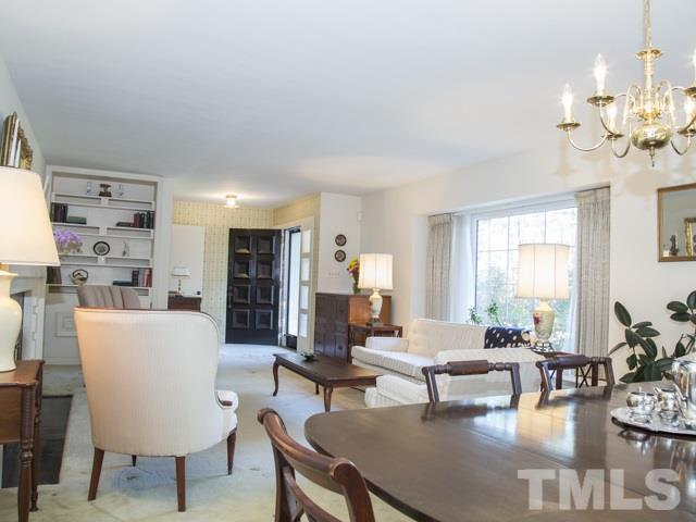 3000 Buckingham Road Durham, NC 27707 - Photo 3 of 25 a living room with fireplace furniture and a large window