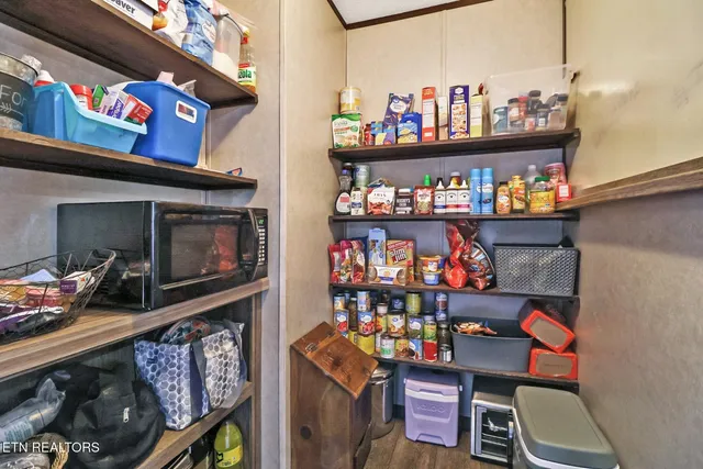 a store room with lots of fruit and a table