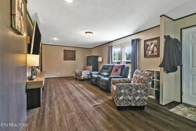 a living room with furniture and a window