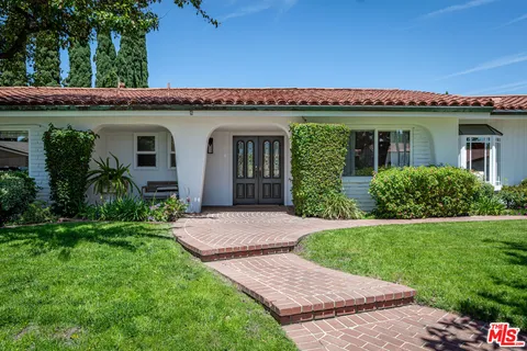 a view of a house with a garden