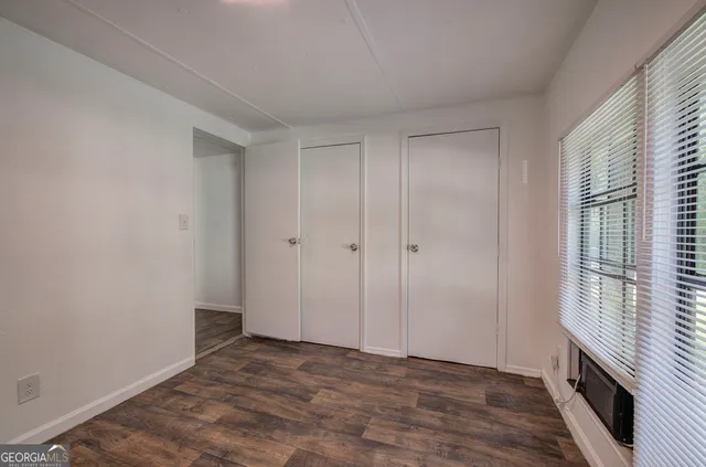 a view of an empty room with a window