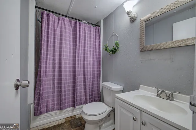 a bathroom with a sink and toilet