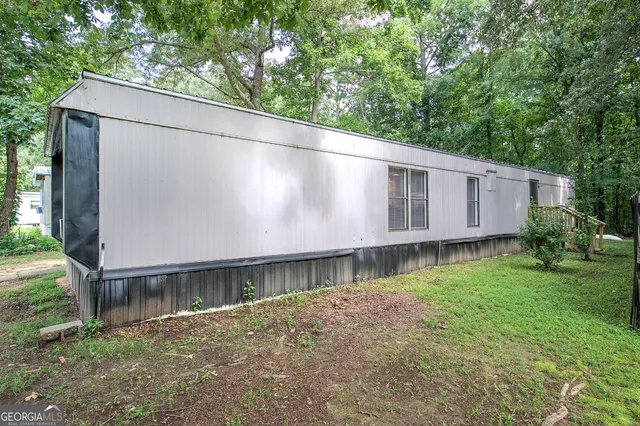 a backyard of a house with lots of green space
