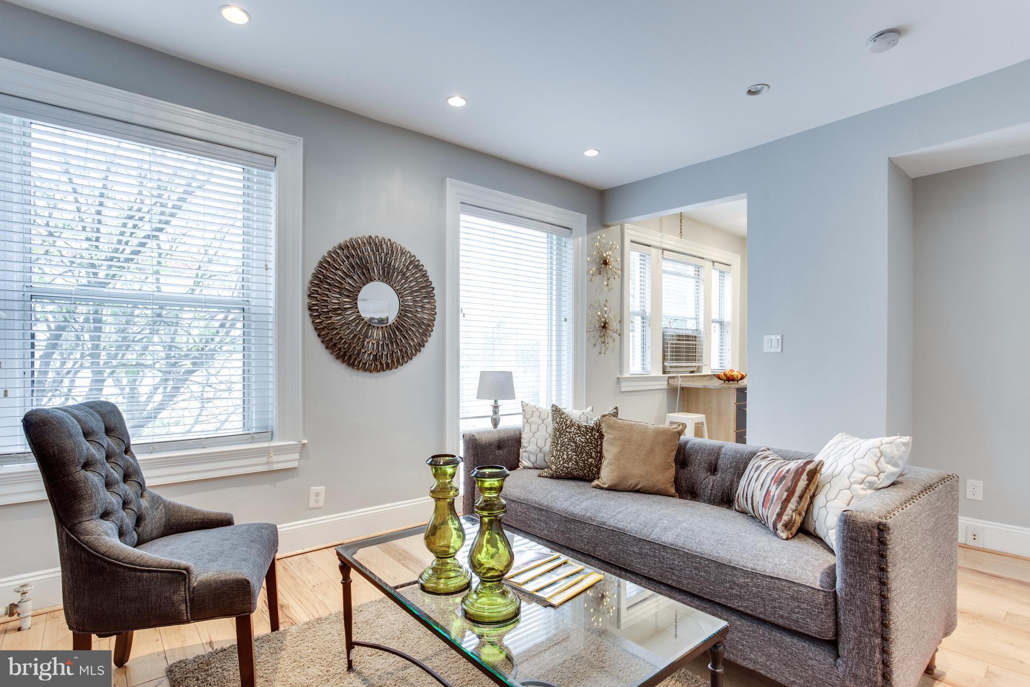 1523 Park Road Northwest, Unit 202 Washington, DC 20010 - Photo 2 of 13 a living room with furniture and a window