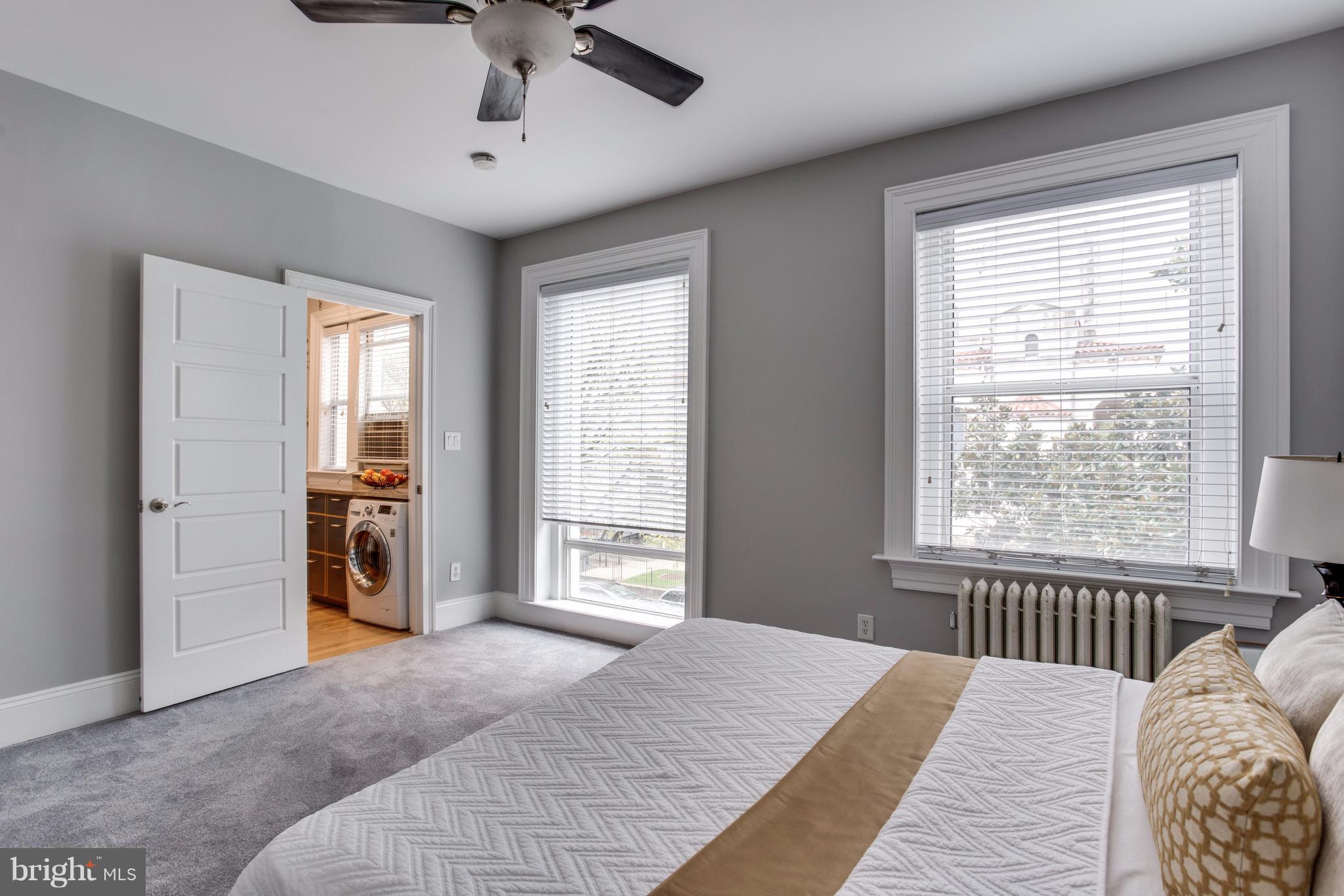 1523 Park Road Northwest, Unit 202 Washington, DC 20010 - Photo 10 of 13 a bedroom with a bed and a window