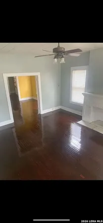 a view of room with window and hardwood floor