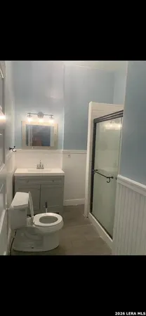 a bathroom with a sink and mirror
