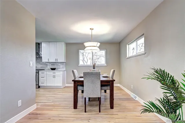 a view of a dining room with furniture window and wooden floor