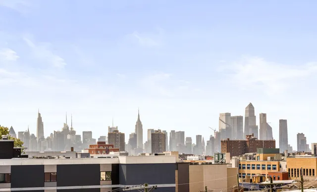 a view of a city with tall buildings