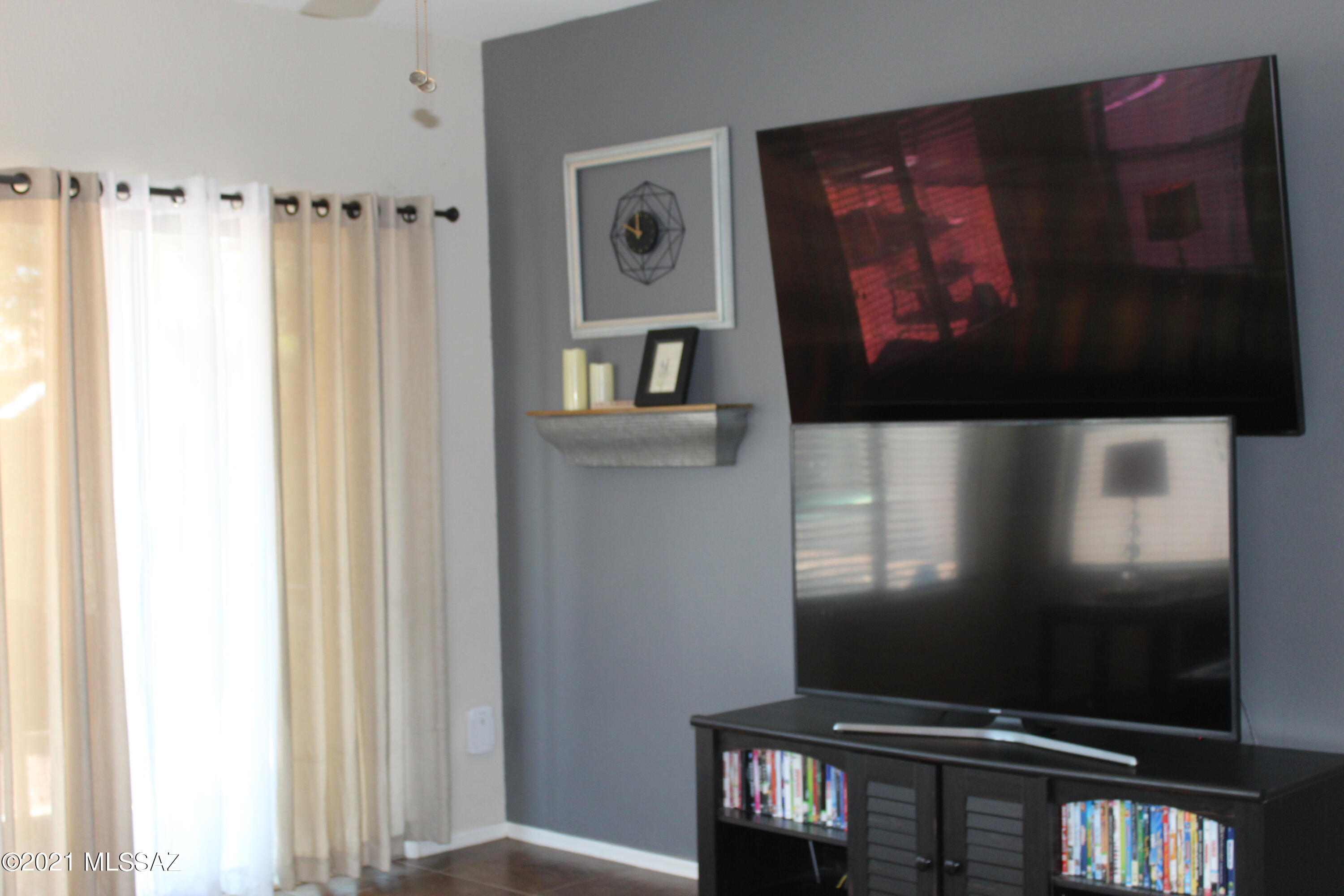 20951 East Reunion Road Red Rock, AZ 85145 - Photo 13 of 35 a living room with furniture and a flat screen tv