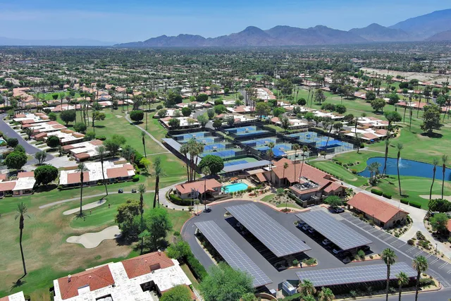 an aerial view of residential houses and outdoor space