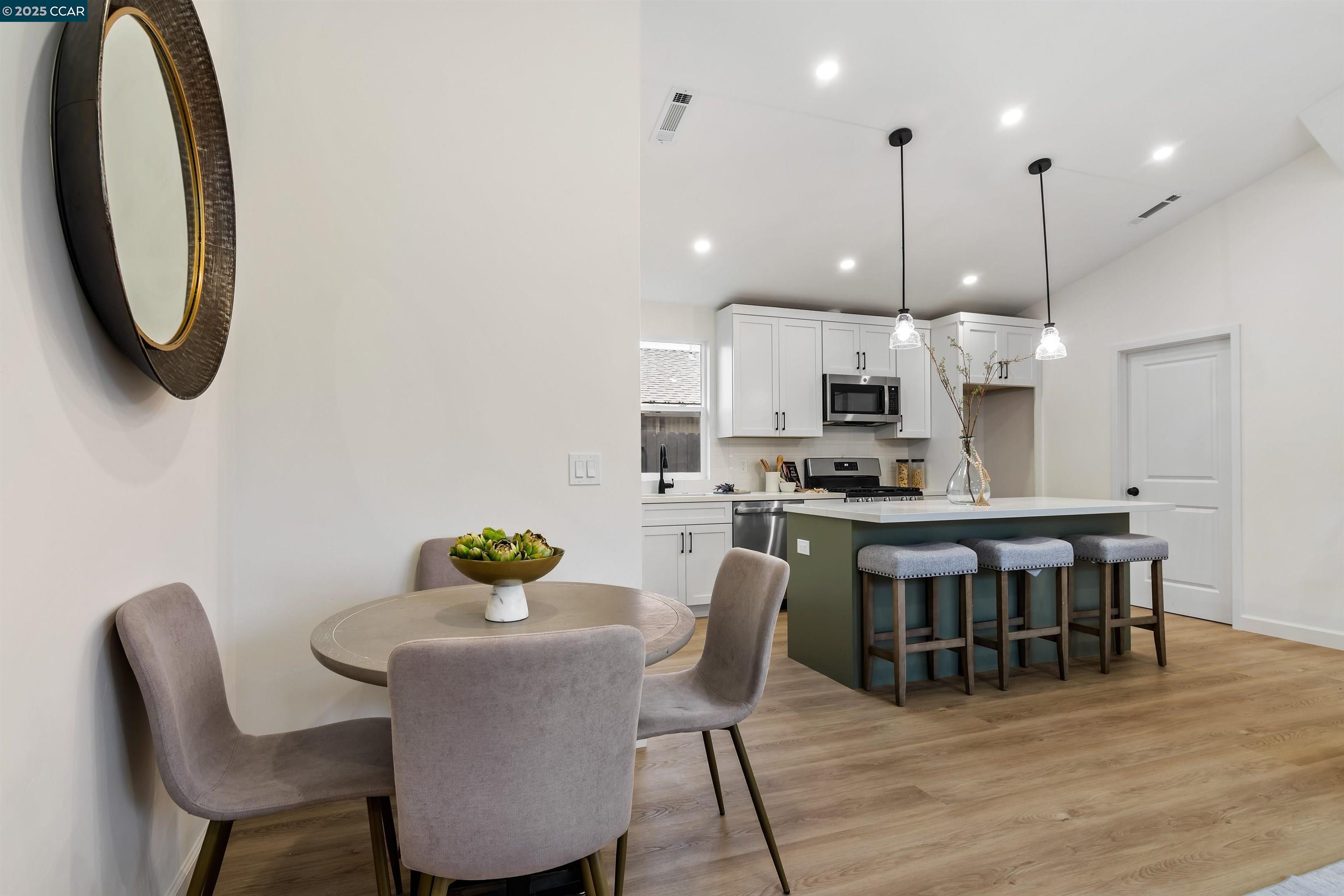 330 Warren Way Pittsburg, CA 94565 - Photo 13 of 37 a dining room with stainless steel appliances granite countertop a dining table chairs and kitchen view
