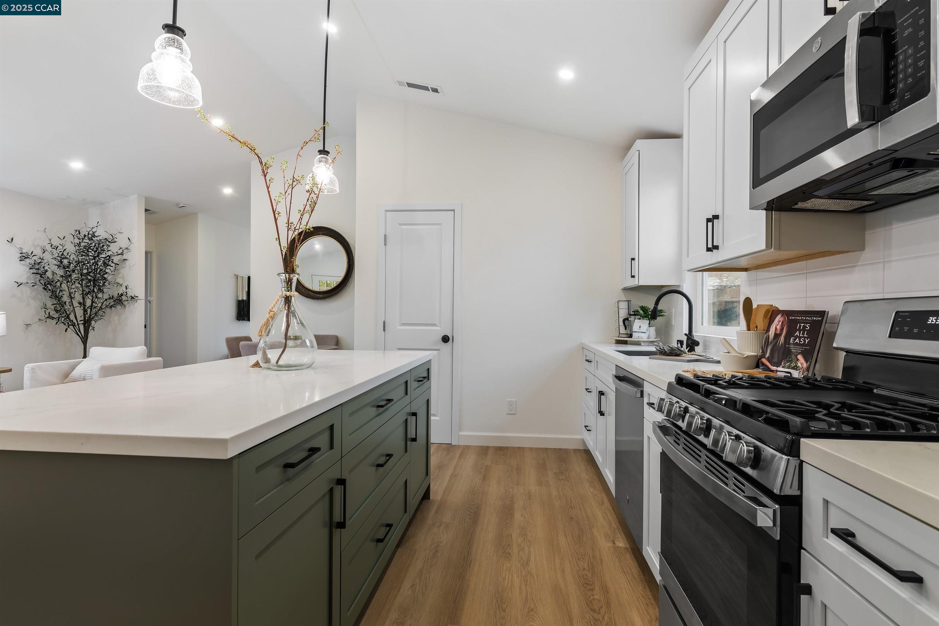 330 Warren Way Pittsburg, CA 94565 - Photo 15 of 37 a kitchen with a sink stove and cabinets