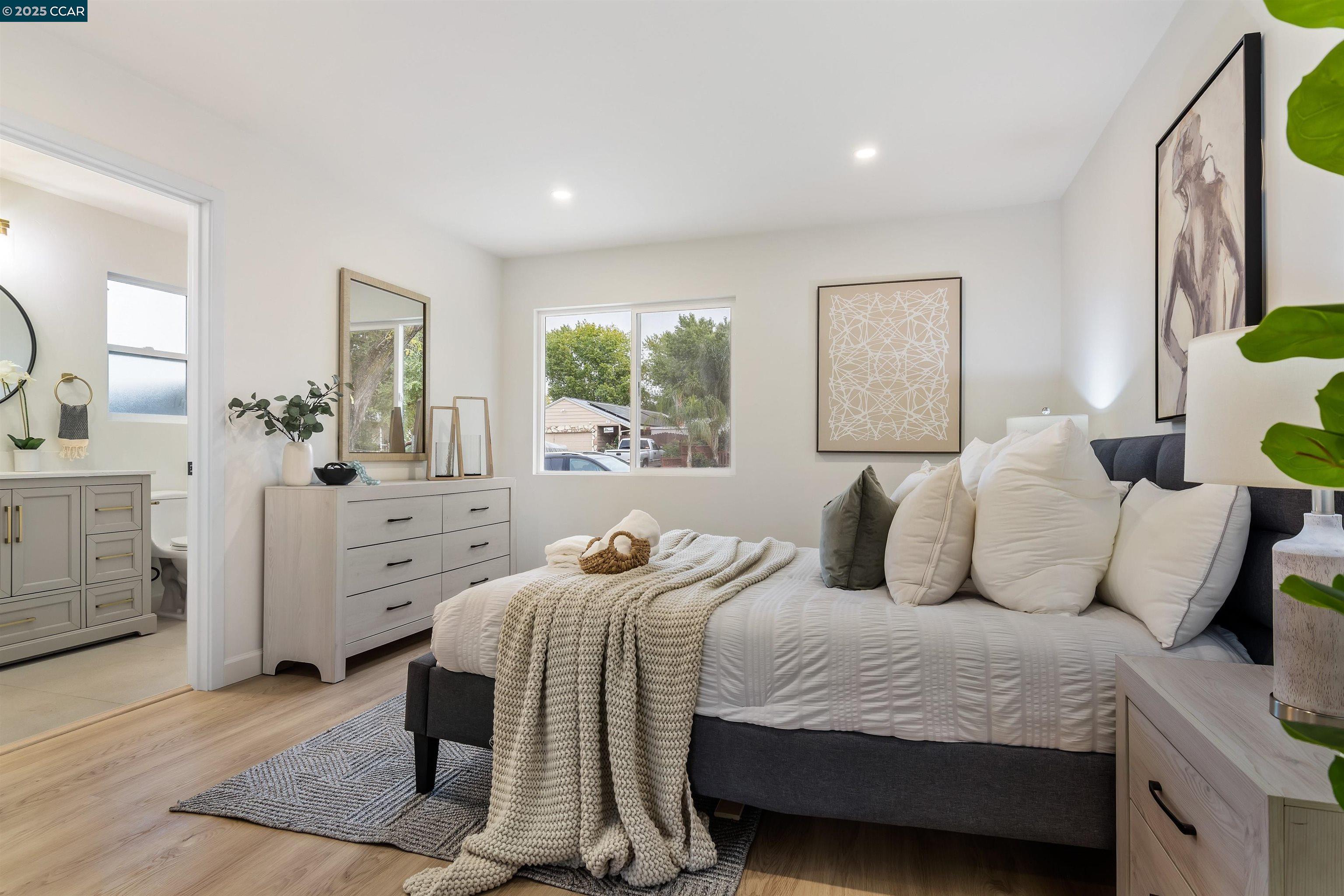 330 Warren Way Pittsburg, CA 94565 - Photo 22 of 37 a bedroom with a bed and a dresser