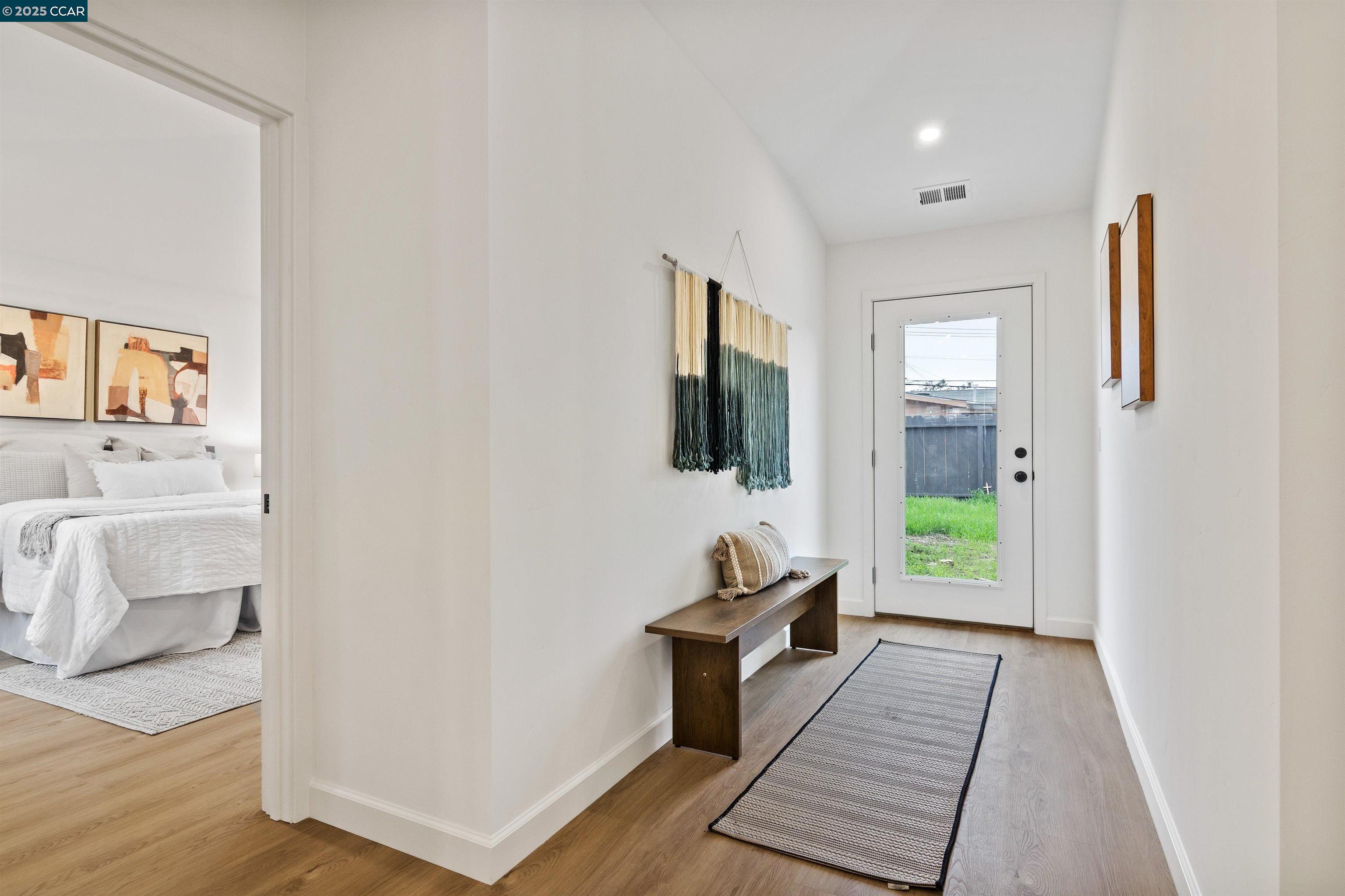 330 Warren Way Pittsburg, CA 94565 - Photo 26 of 37 a view of a hallway with wooden floor and a living room