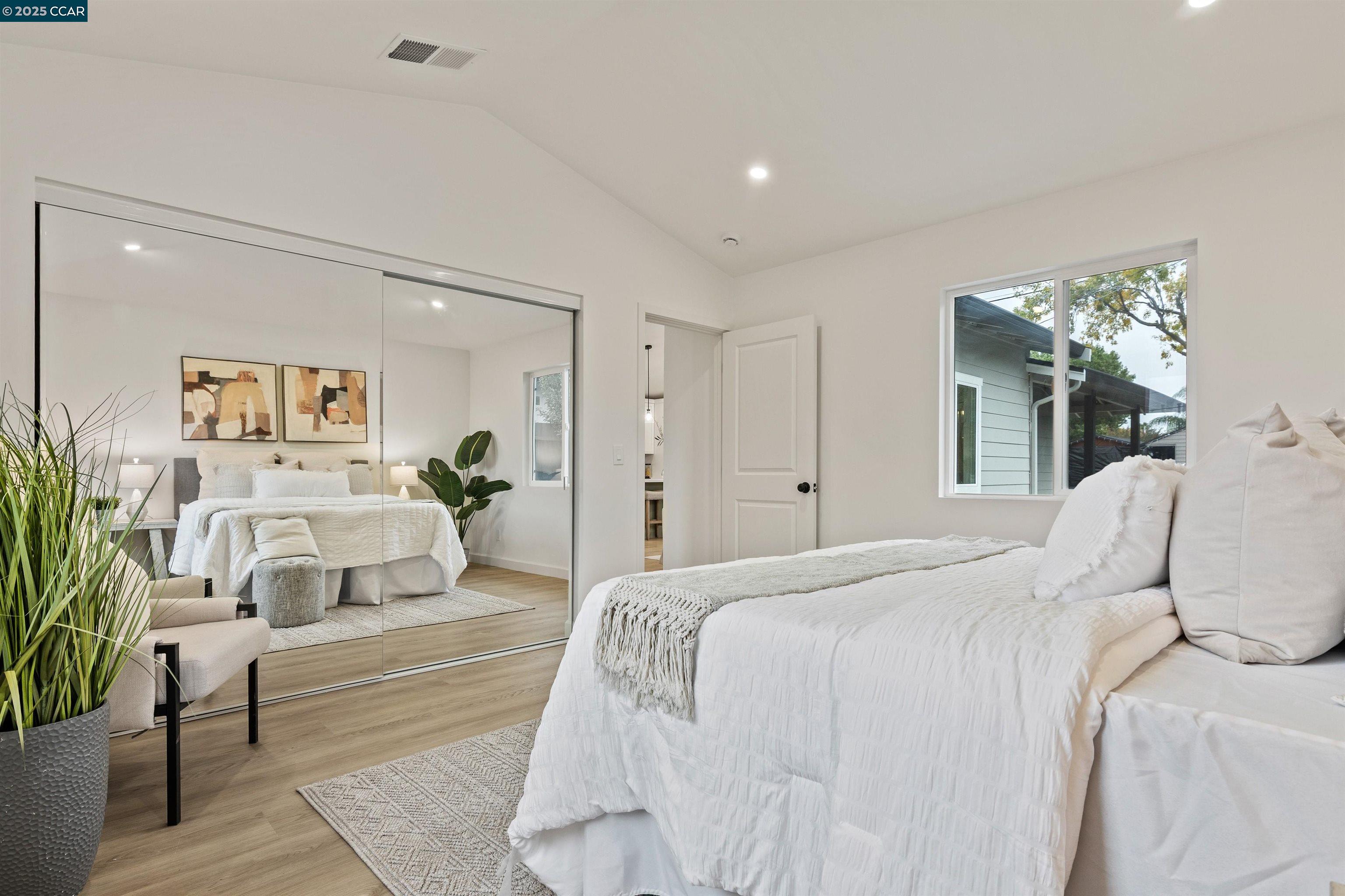 330 Warren Way Pittsburg, CA 94565 - Photo 30 of 37 a bedroom with a large bed and a couch