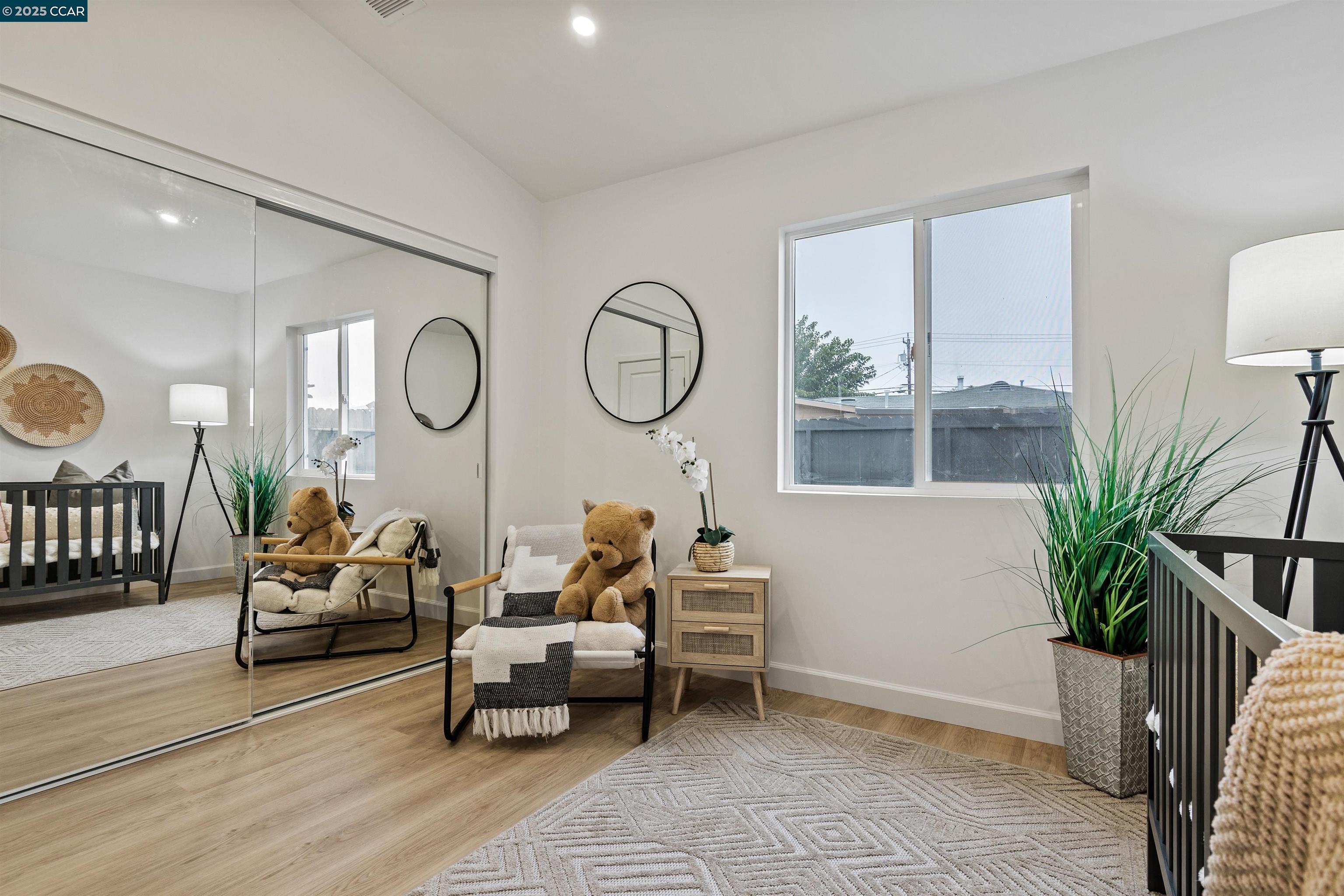 330 Warren Way Pittsburg, CA 94565 - Photo 32 of 37 a living room with furniture a large window and a potted plant
