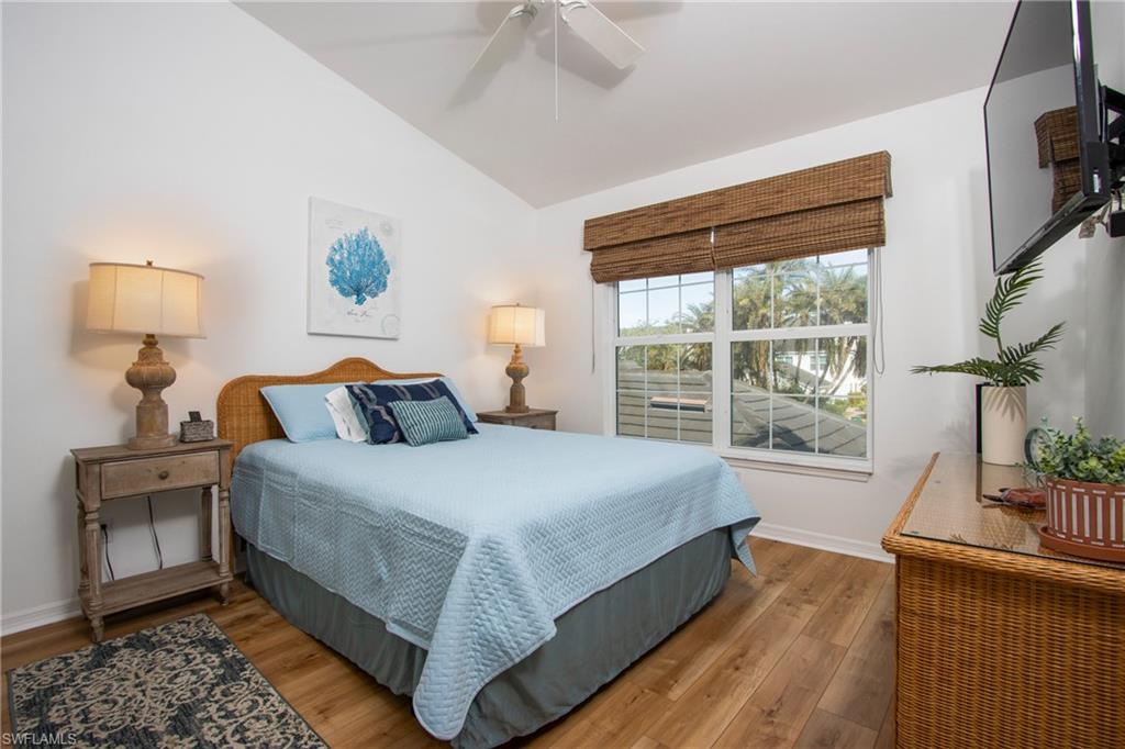 5937 Sand Wedge Lane, Unit 1507 Naples, FL 34110 - Photo 11 of 19 a bedroom with bed and window