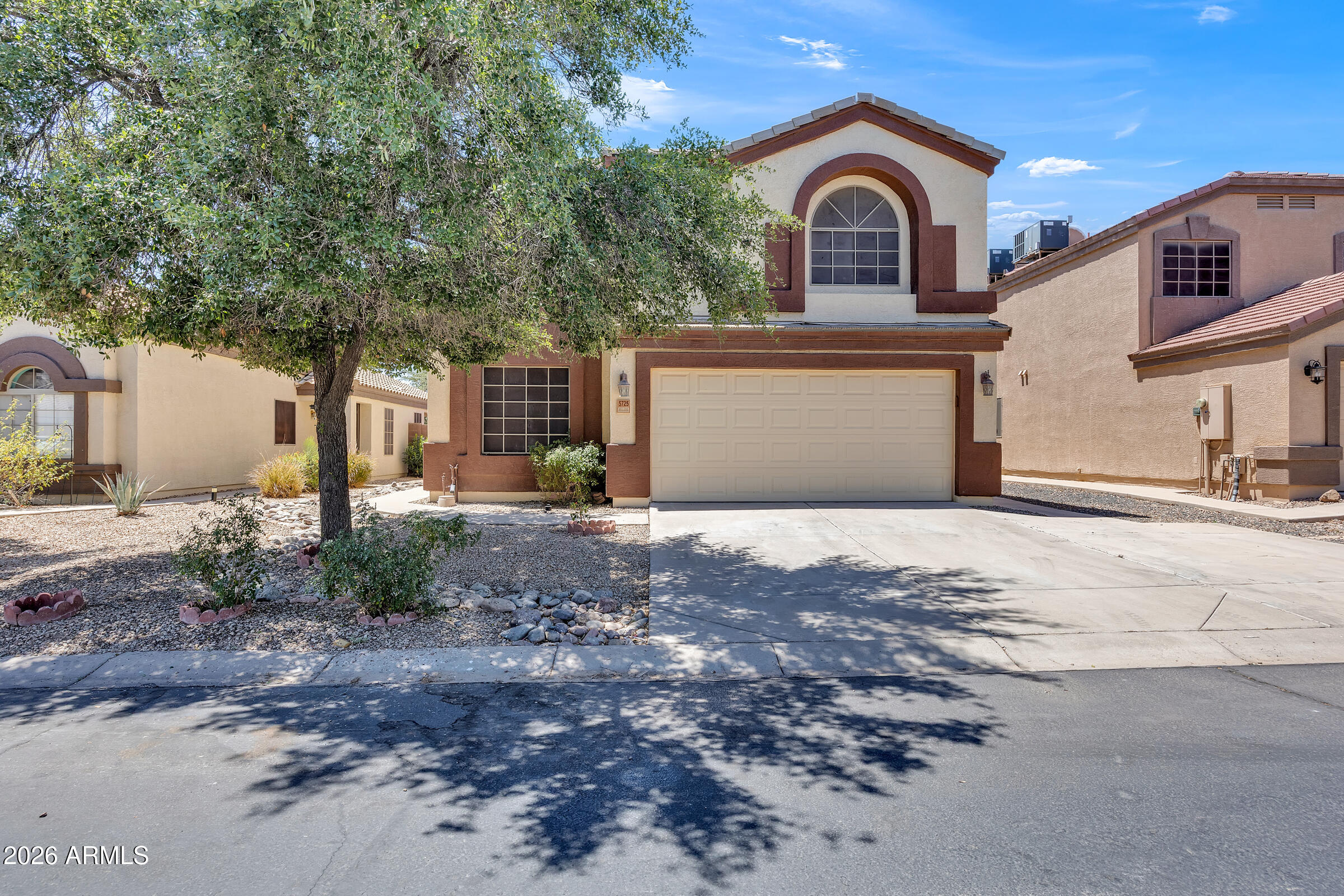 5725 East Good Pasture Lane Florence, AZ 85132 - Photo 1 of 40 a front view of a house with garden
