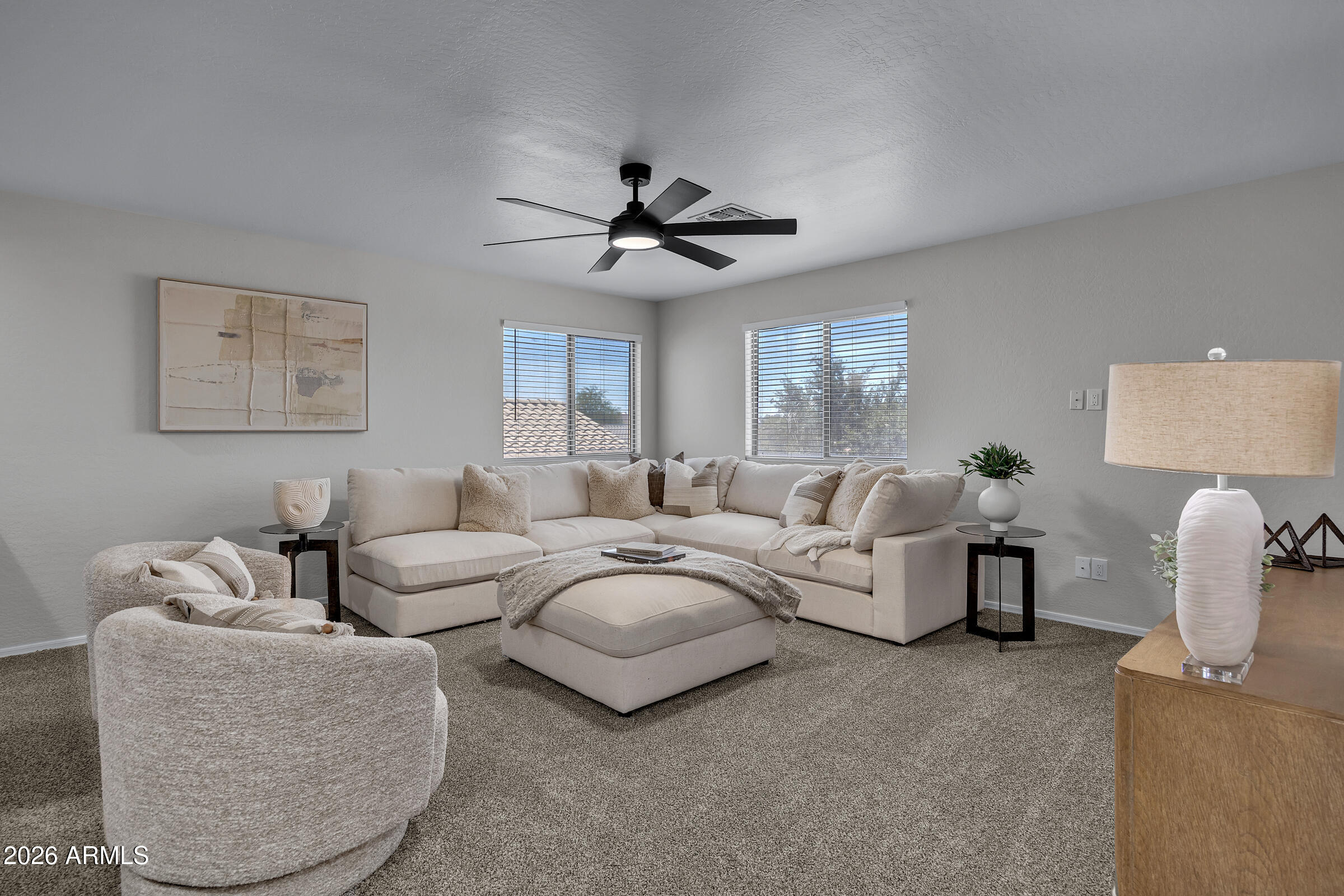 5725 East Good Pasture Lane Florence, AZ 85132 - Photo 20 of 40 a living room with furniture and a ceiling fan