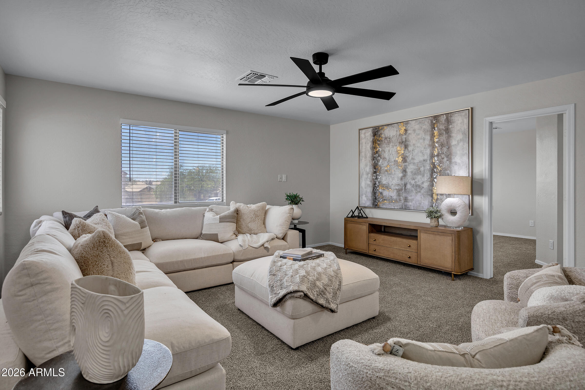 5725 East Good Pasture Lane Florence, AZ 85132 - Photo 21 of 40 a living room with furniture and a large window