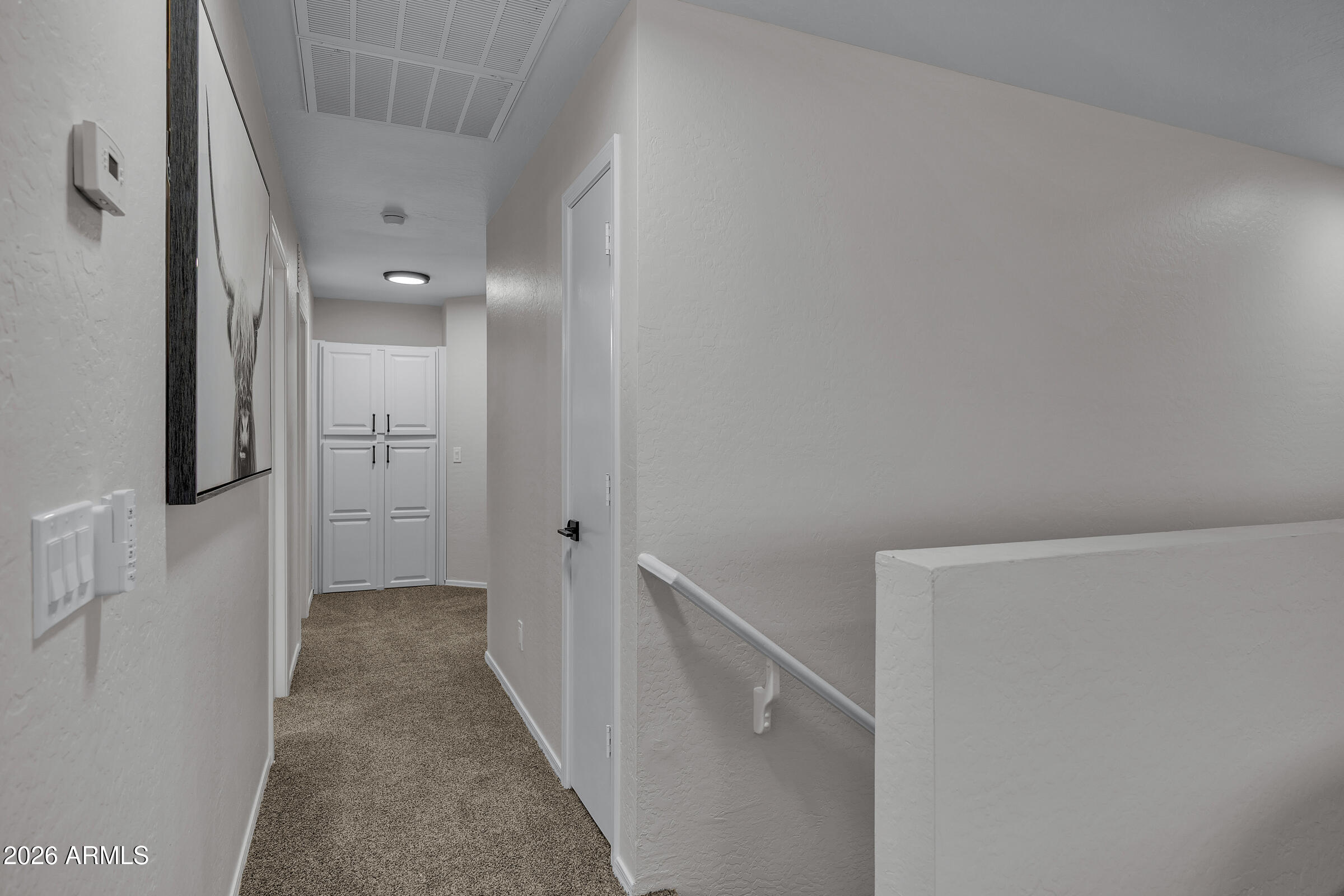 5725 East Good Pasture Lane Florence, AZ 85132 - Photo 23 of 40 a view of a hallway with white walls