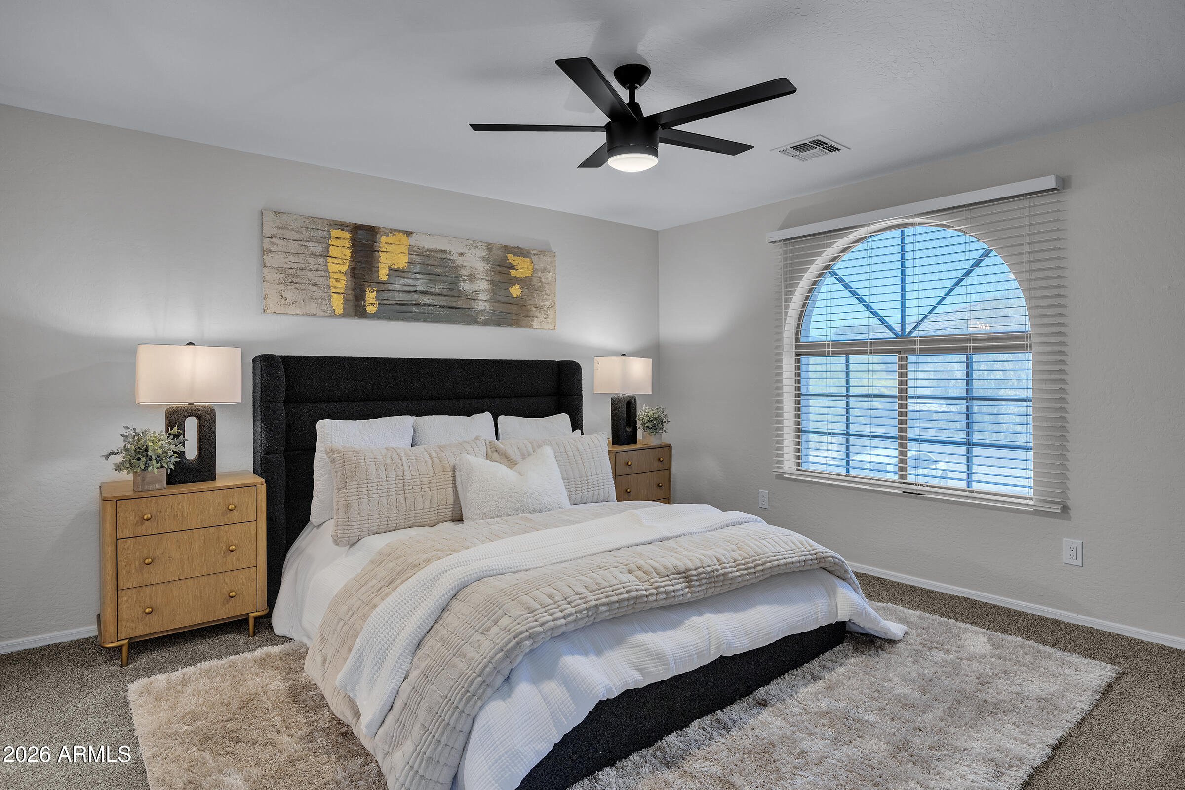 5725 East Good Pasture Lane Florence, AZ 85132 - Photo 28 of 40 a bedroom with a large bed and a window