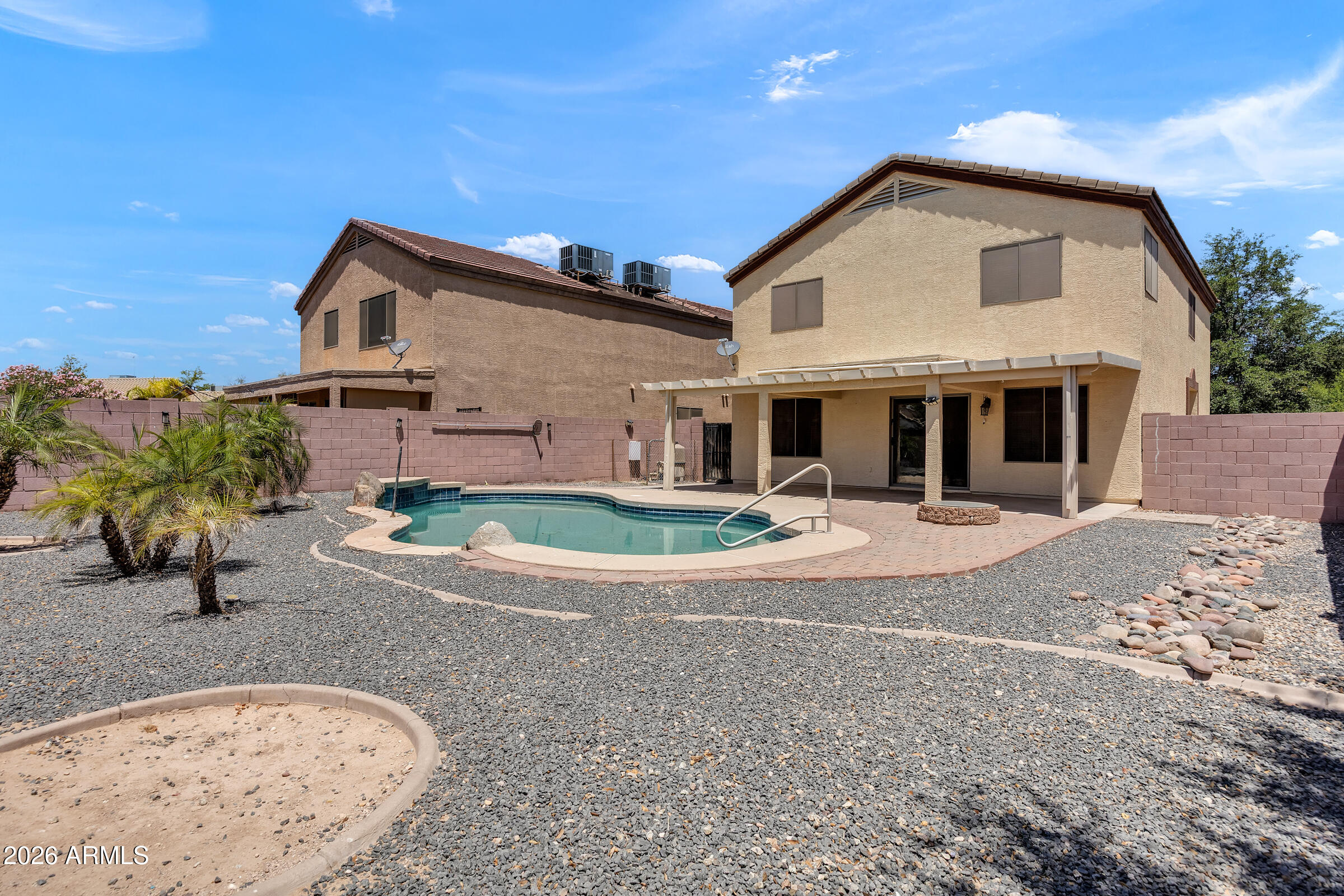 5725 East Good Pasture Lane Florence, AZ 85132 - Photo 35 of 40 a front view of a house with a yard and garage