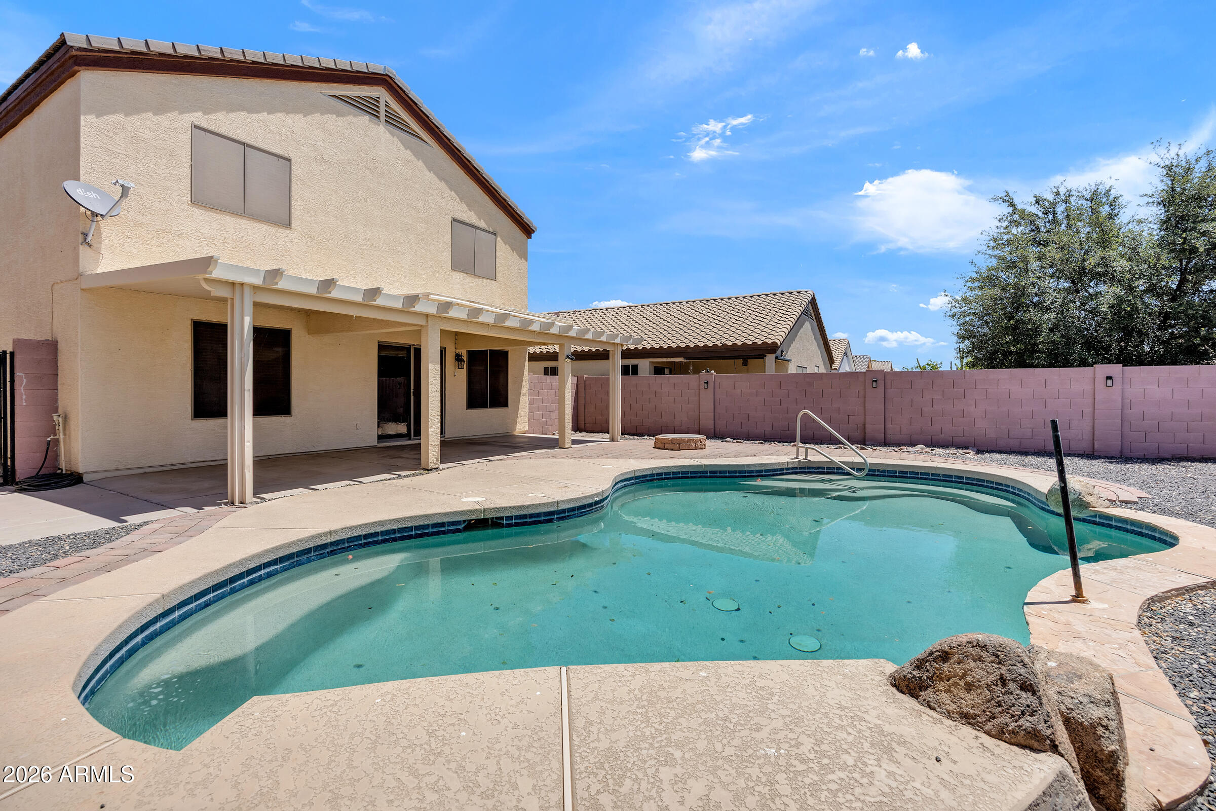 5725 East Good Pasture Lane Florence, AZ 85132 - Photo 38 of 40 a view of a house with a backyard and a patio
