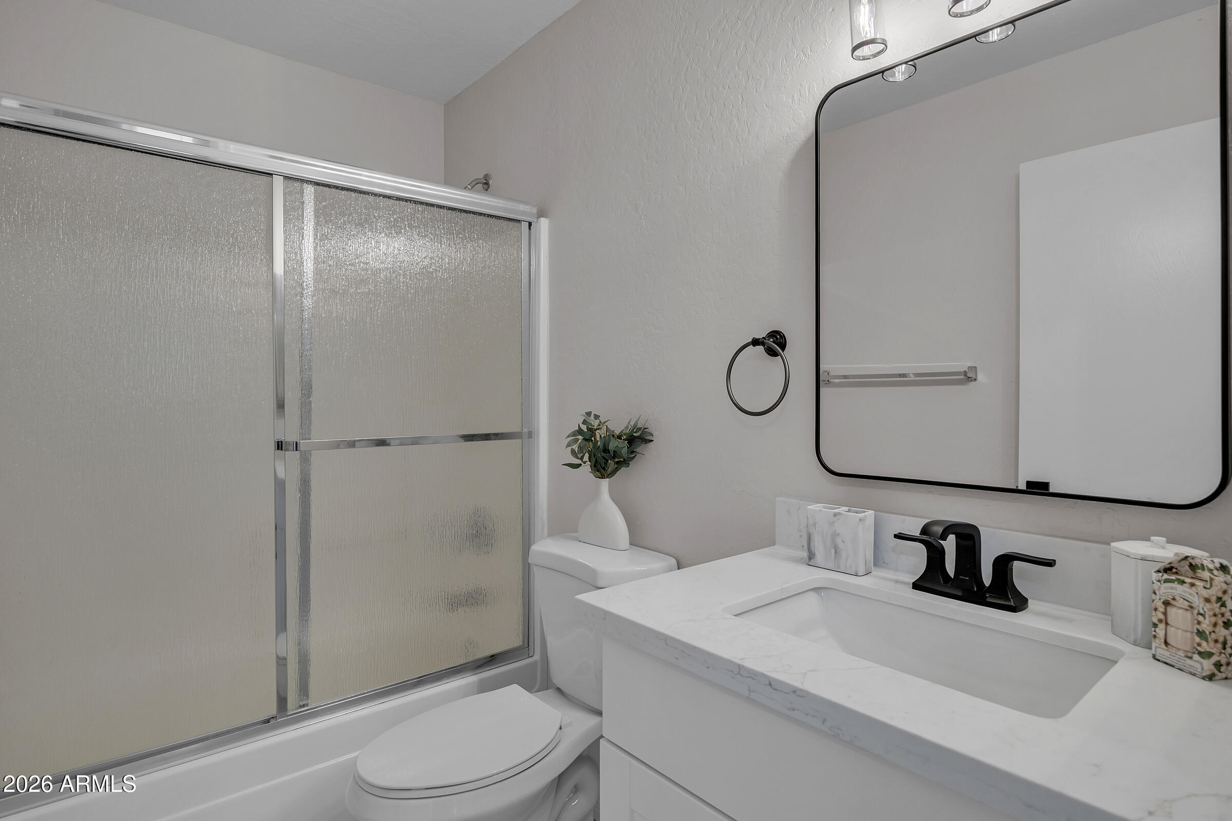 5725 East Good Pasture Lane Florence, AZ 85132 - Photo 8 of 40 a bathroom with a sink toilet and shower