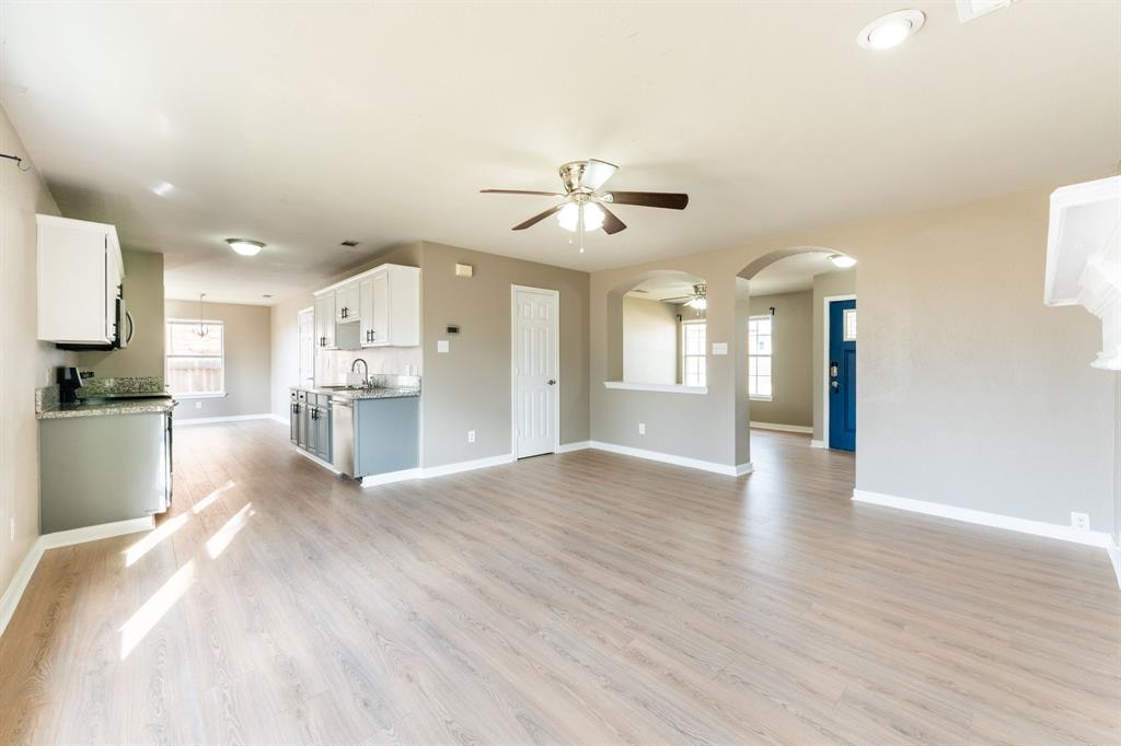 1101 Halifax Lane Forney, TX 75126 - Photo 11 of 32 a view of a kitchen with a sink and a stove top oven