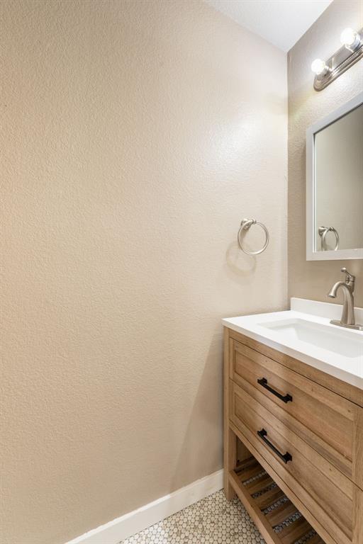 1101 Halifax Lane Forney, TX 75126 - Photo 15 of 32 a bathroom with a sink and a mirror