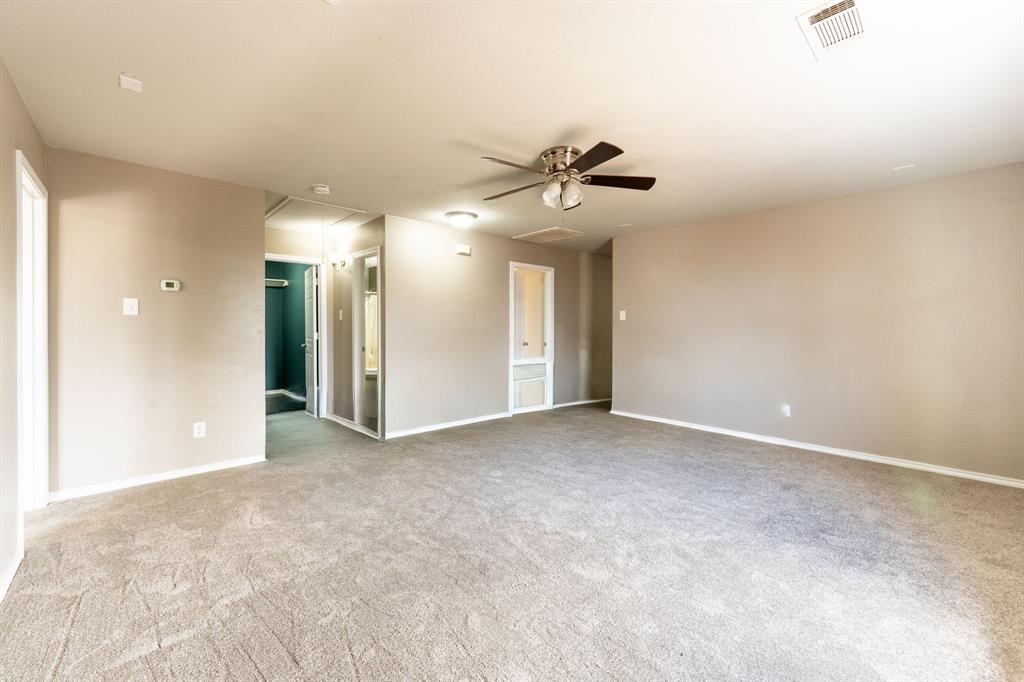 1101 Halifax Lane Forney, TX 75126 - Photo 18 of 32 a view of a hallway with a chandelier