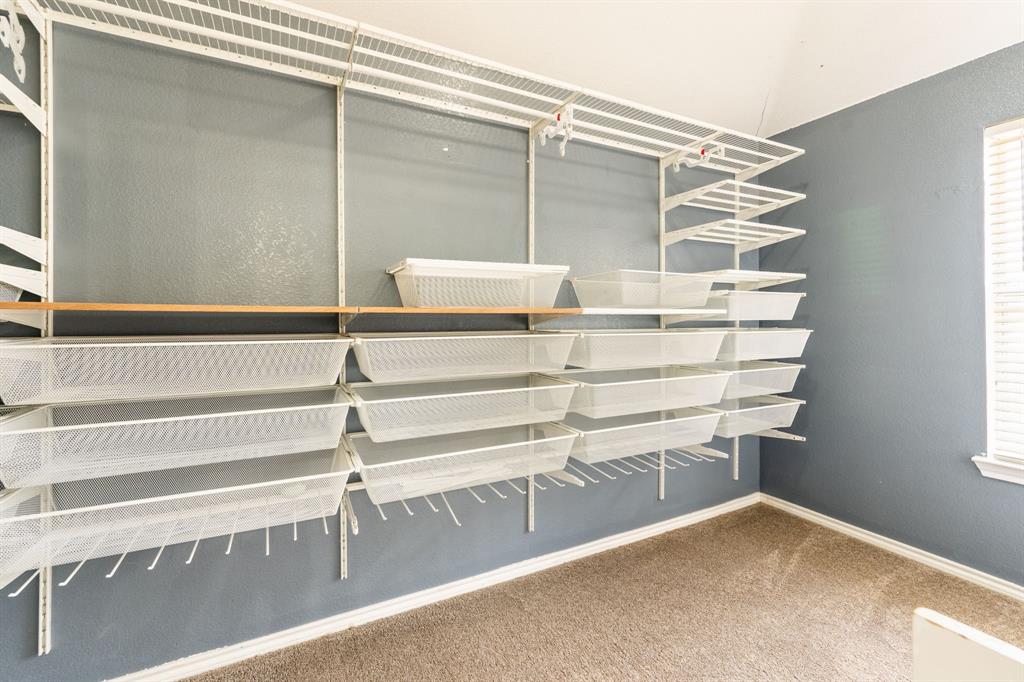 1101 Halifax Lane Forney, TX 75126 - Photo 22 of 32 a view of walk in closet with empty racks