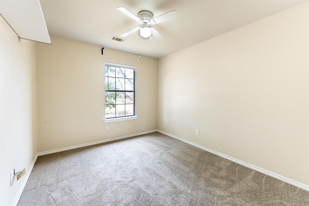 1101 Halifax Lane Forney, TX 75126 - Photo 23 of 32 an empty room with windows and fan