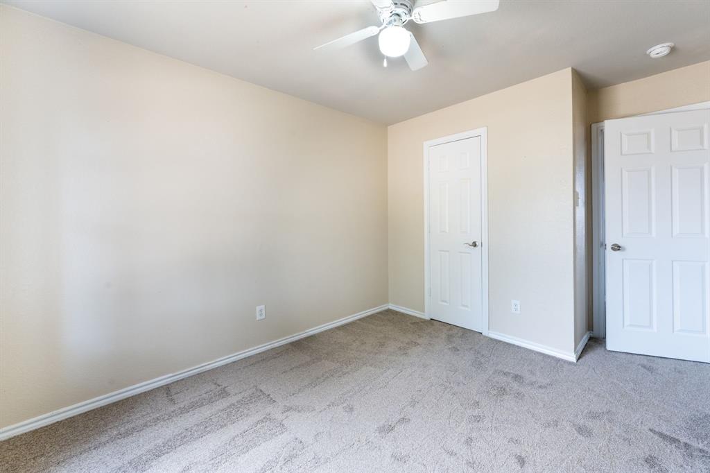 1101 Halifax Lane Forney, TX 75126 - Photo 24 of 32 an empty room with a chandelier fan