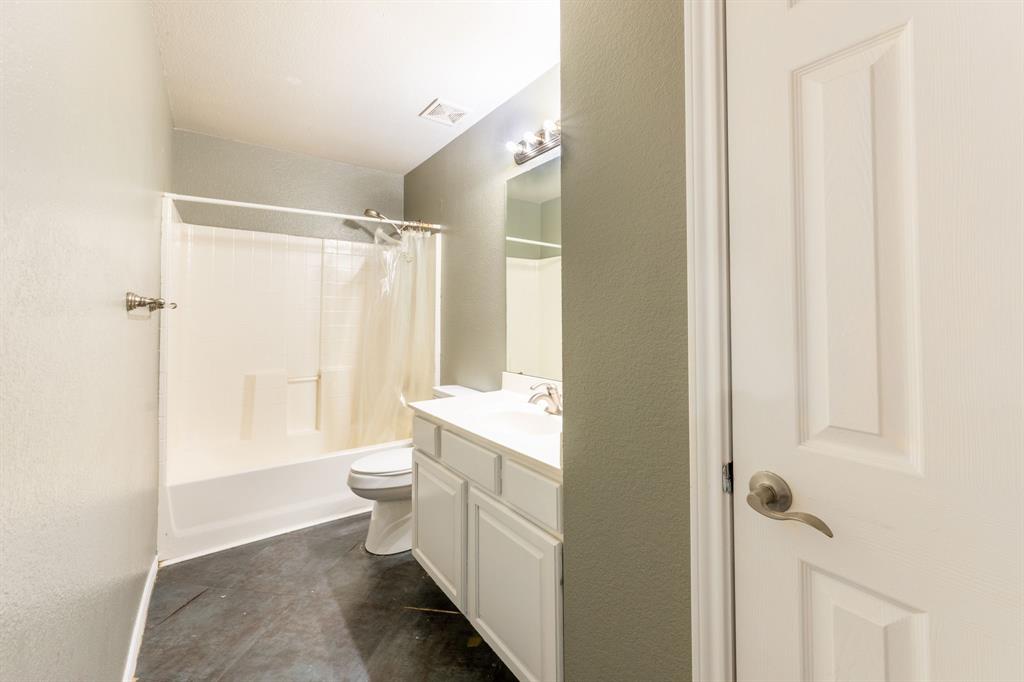 1101 Halifax Lane Forney, TX 75126 - Photo 25 of 32 a bathroom with a double vanity sink toilet and shower