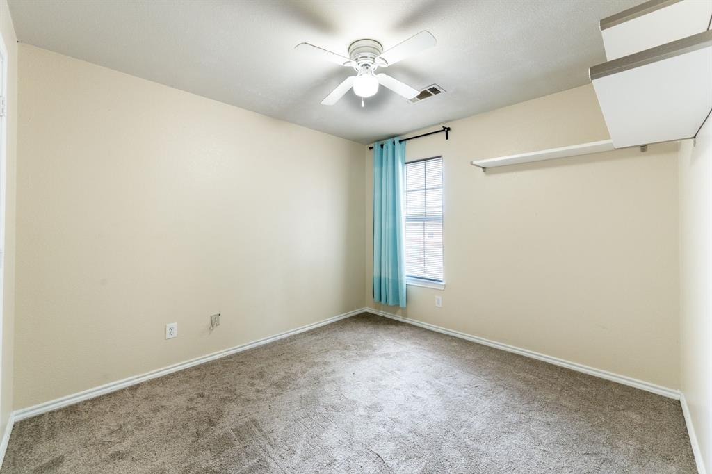 1101 Halifax Lane Forney, TX 75126 - Photo 26 of 32 an empty room with windows and fan