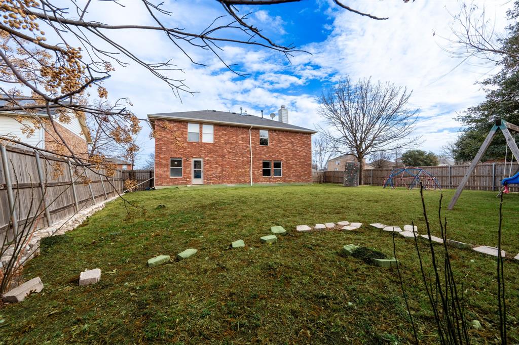 1101 Halifax Lane Forney, TX 75126 - Photo 28 of 32 a view of a house with a yard