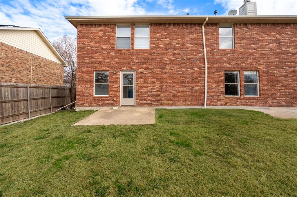 1101 Halifax Lane Forney, TX 75126 - Photo 29 of 32 a view of a brick house with a large window