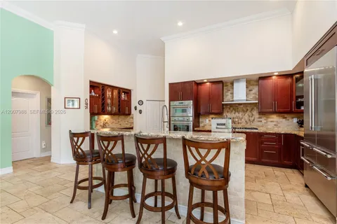 a view of a dining room with furniture and window