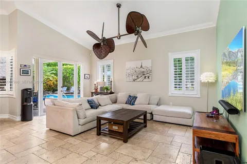a large kitchen with a table and chairs