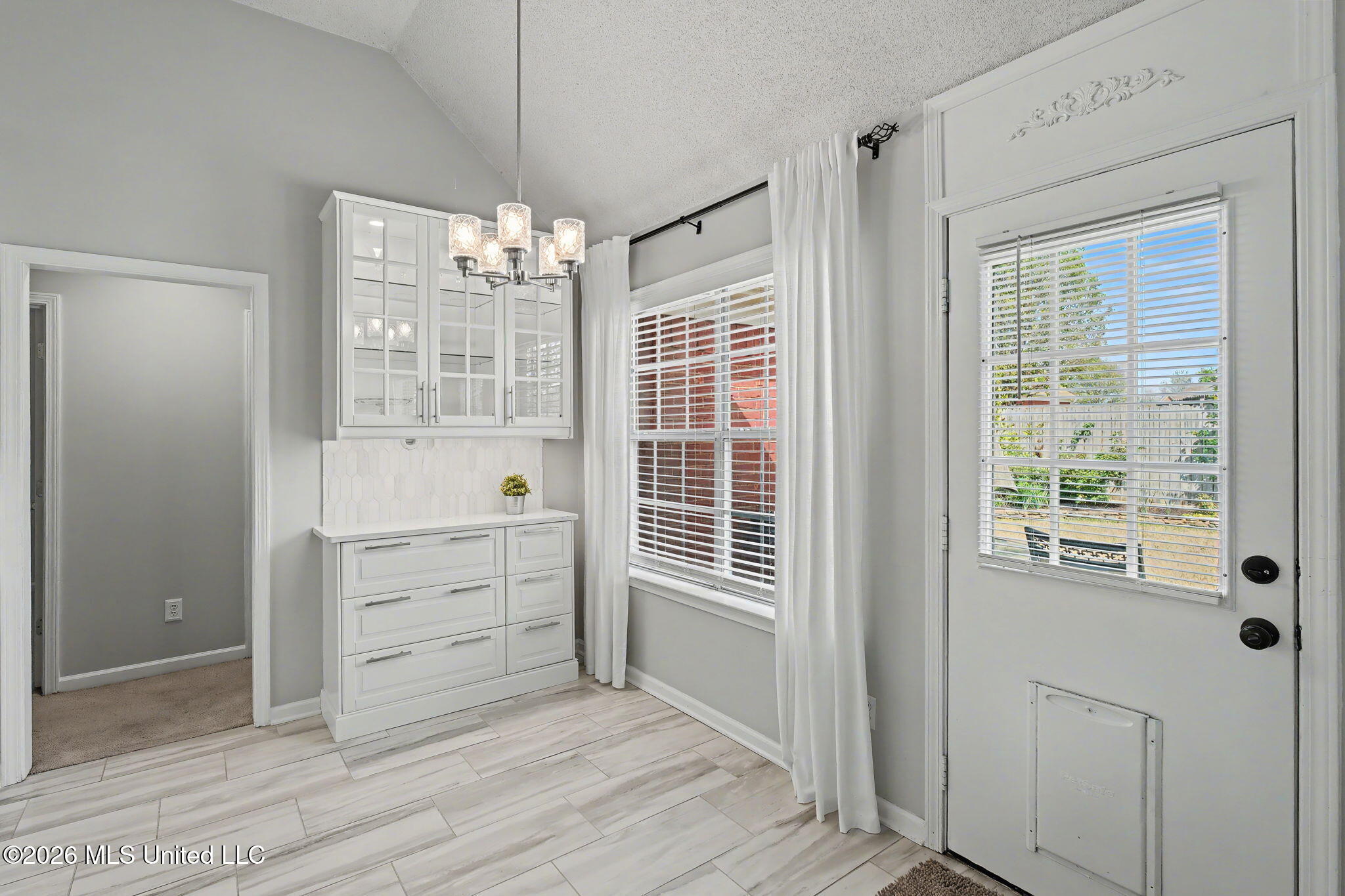 7740 Meadow Ridge Lane Olive Branch, MS 38654 - Photo 10 of 40 Additional cabinets with glass doors