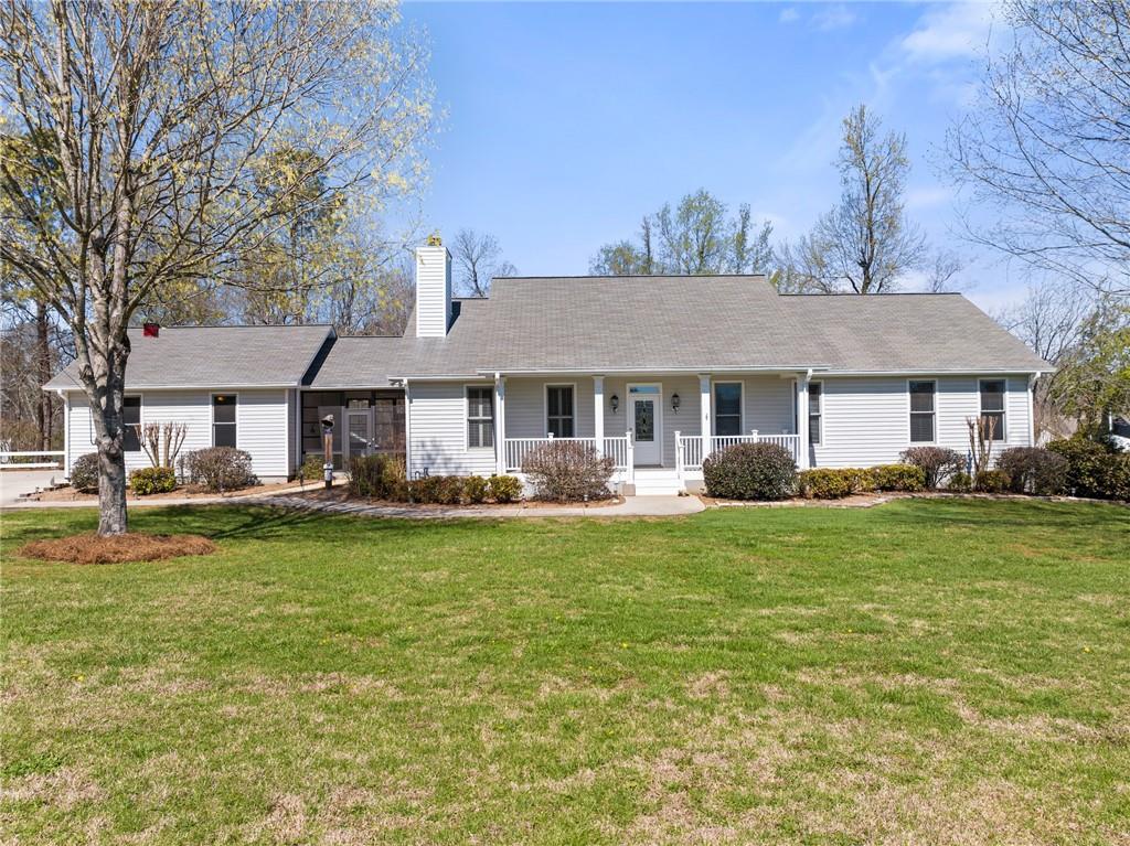 5480 Karr Road Cumming, GA 30028 - Photo 1 of 1 a front view of a house with swimming pool having outdoor seating