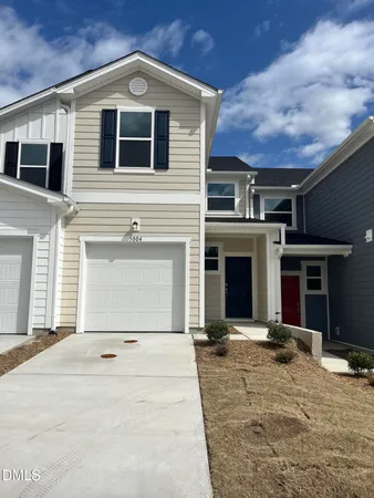 a front view of a house with yard