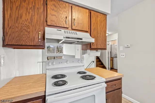 a kitchen with a stove and a refrigerator