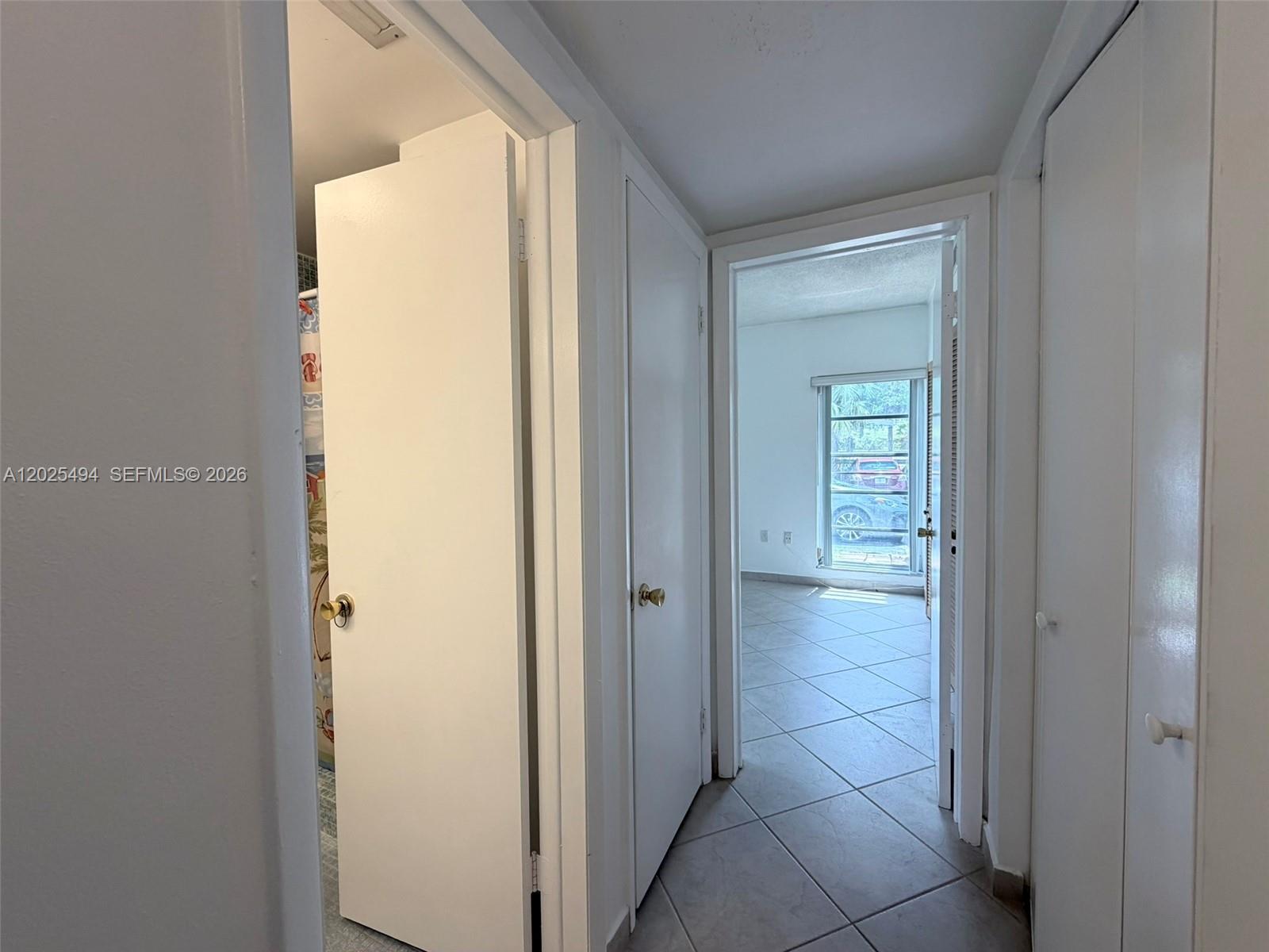 9159 Southwest 77th Avenue, Unit 112 Miami, FL 33156 - Photo 18 of 38 a view of a hallway