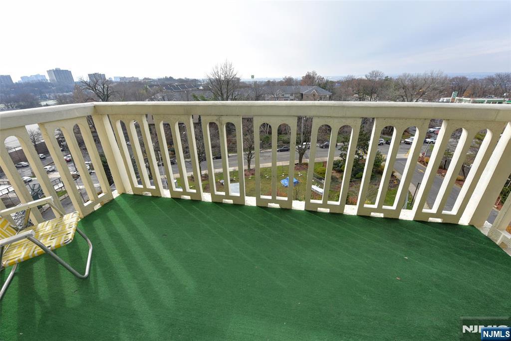 555 North, Unit 8N Fort Lee, NJ 07024 - Photo 18 of 19 a view of a deck with a yard