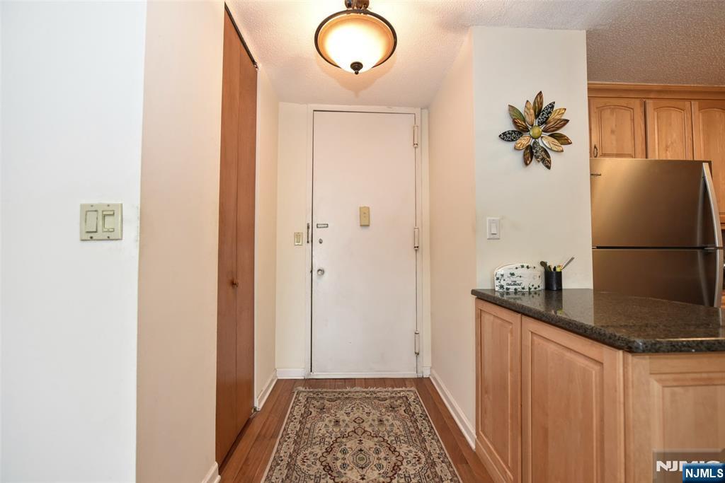 555 North, Unit 8N Fort Lee, NJ 07024 - Photo 6 of 19 a view of a hallway to a room