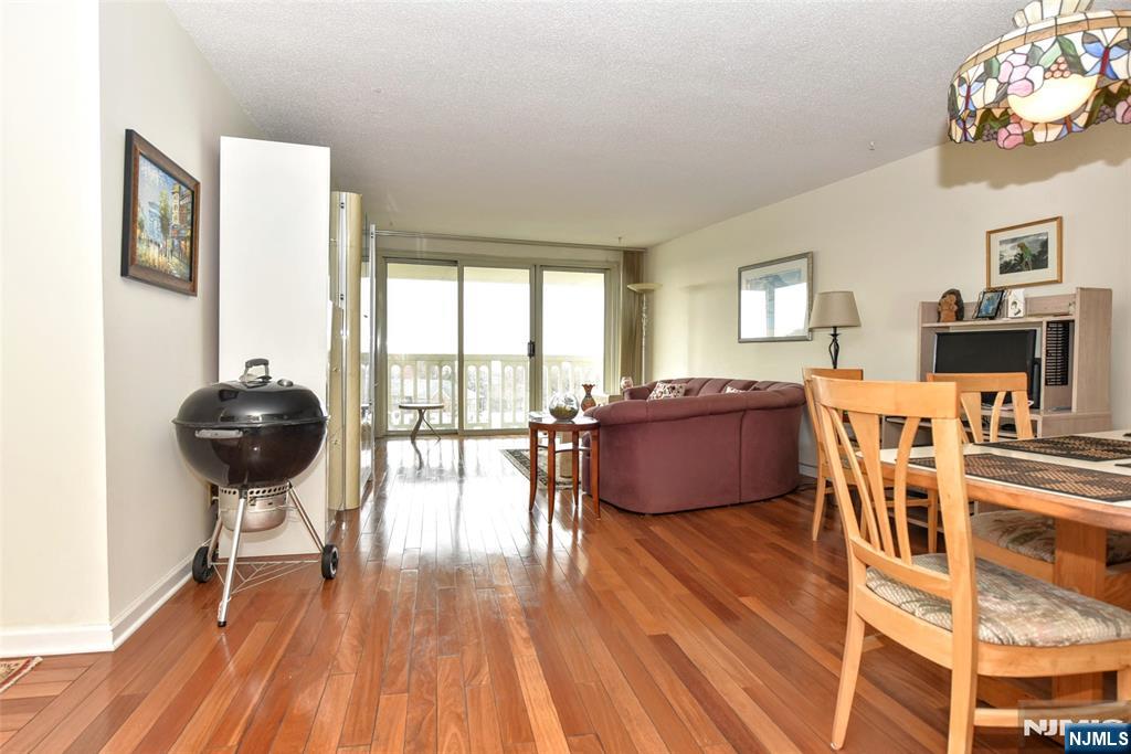 555 North, Unit 8N Fort Lee, NJ 07024 - Photo 7 of 19 a living room with furniture and a wooden floor
